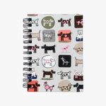 Load image into Gallery viewer, 5 x 7 Spiral Dogs Glitter Journal. Varied, stylized, multicolored, cartoon drawings of dogs on a tan background. Shop a selection of notebooks &amp; journals at blueigloo.ca
