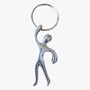 Deluxe Key Chain-Figure. A metal, chrome, round key ring with a figure hanging from the ring by the hand on a white background. Shop keychains, novelty gifts and lifestyle products online at blueigloo.ca