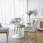 Load image into Gallery viewer, Flute Oval Marble Top Dining Table-Condo Size by Style In Form. Lifestyle shot showing table in a dining room with white stacked dishes on top and 3 chairs around the table. Shop vintage &amp; new home décor, lighting &amp; home furnishings as well as novelty gifts &amp; pet accessories online at blueigloo.ca
