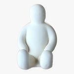 Load image into Gallery viewer, Resin Figure Hook, White. Front view. A suction hook shaped like a person sitting with their arms resting on the top of their thighs. Legs are extended straight out in front of them. Shop suction hooks and other bath accessories at blueigloo.ca
