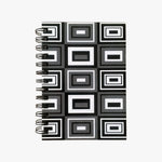 Load image into Gallery viewer, 5x7 Spiral B&amp;W Rectangles Journal. Top view of cover shown. Varied, black and white geometric rectangles outlined in white and black on a  grey background. Shop a selection of notebooks &amp; journals at blueigloo.ca
