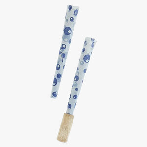 Juicy Jay's Pre-rolled Cones-2 pk, Blueberry. Shown two pre-rolled cones with cartoon blueberries printed randomly on the white paper with the Dank 7 tip inserted onto one ofthe pre-rolled cone ends. Shop rolling papers, pre-rolled cones and smoking accessories at blueigloo.ca