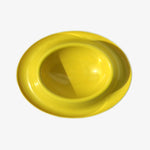 Load image into Gallery viewer, Chow Dog Bowl by UMBRA. Color: Yellow/Orange. Top view of bowl on off white backround. Shop vintage &amp; new home décor, lighting &amp; home furnishings as well as novelty gifts &amp; pet accessories online at blueigloo.ca
