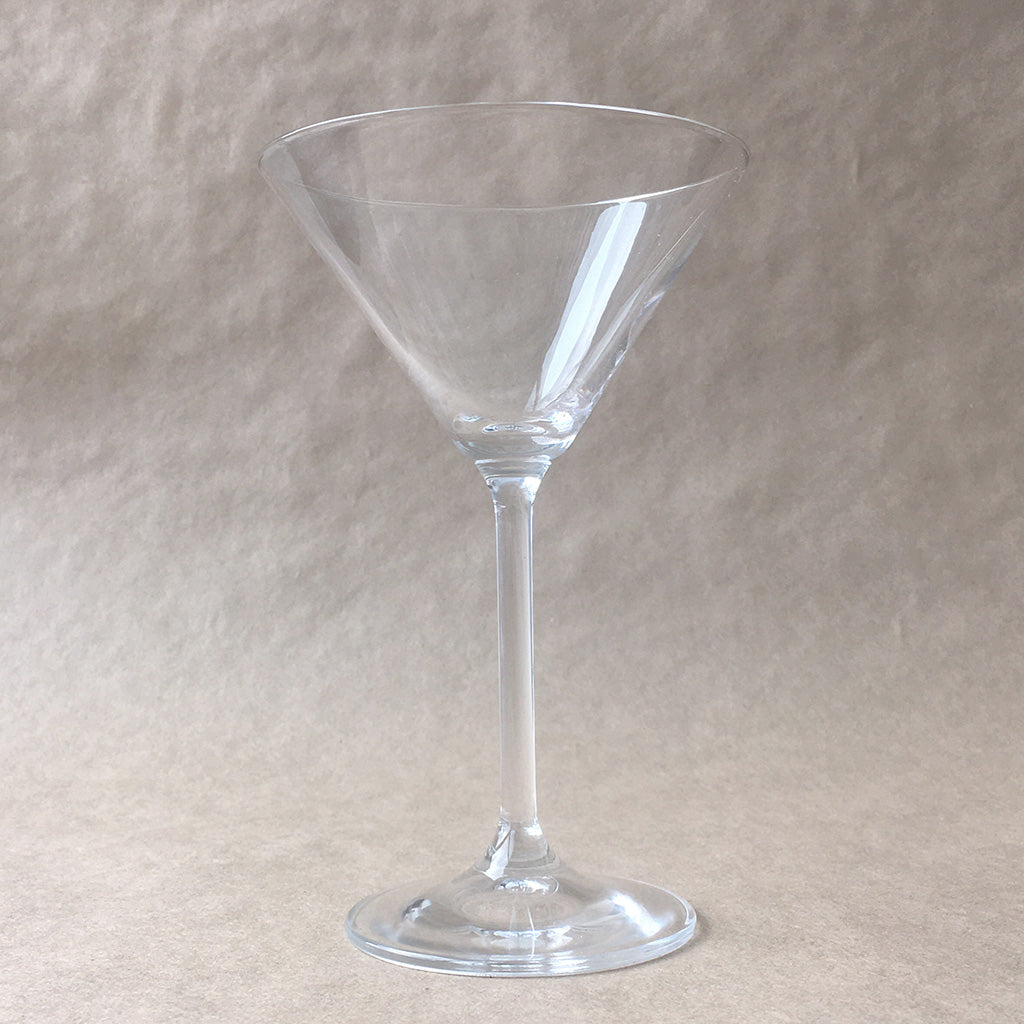 Connoisseur Martini Glass. A single martini glass shown on kraft paper background. Shop barware, serveware, and bar accessories online at blueigloo.ca