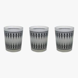 Damask Frosted Tea Light Holder-Set 3. A set of three frosted glass tea light holders with a black damask pattern. Shown in a straight line left to right with an inch between each holder on a white background. Shop tea light holders, decor, and decorative objects online at blueigloo.ca.