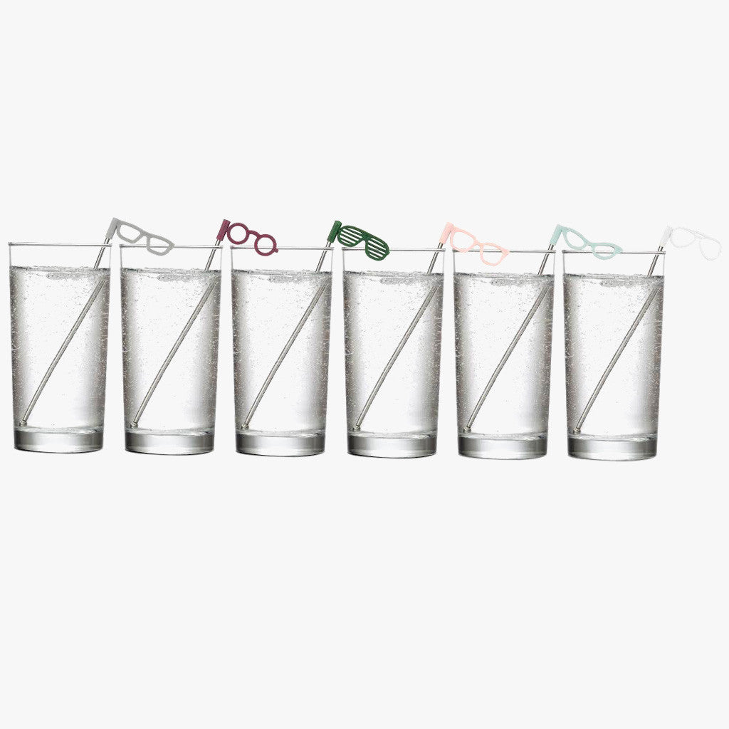 Glasses Stir Sticks by UMBRA. Showing set of 6 drink stir sticks angled standing in clear tallboy glasses with clear bubbly liquid on an off white background. Shop vintage & new home décor, lighting & home furnishings as well as novelty gifts & pet accessories online at blueigloo.ca