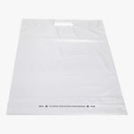 Load image into Gallery viewer, Poly Courier Mailer Bag With Handle, White. Single poly mailer bag shown. Shop shipping supplies at wholesale pricing in small bulk quantities at blueigloo.ca
