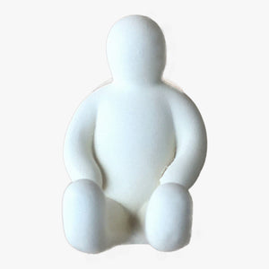 Resin Figure Hook, White. Front view. A suction hook shaped like a person sitting with their arms resting on the top of their thighs. Legs are extended straight out in front of them. Shop suction hooks and other bath accessories at blueigloo.ca
