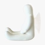 Load image into Gallery viewer, Resin Figure Hook, White. Side view. A suction hook shaped like a person sitting with their arms resting on the top of their thighs. Legs are extended straight out in front of them. Shop suction hooks and other bath accessories at blueigloo.ca
